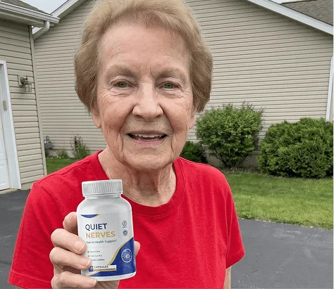 Linda holding her bottle of Quiet Nerves