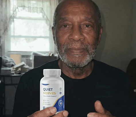 Charles holding his bottle of Quiet Nerves